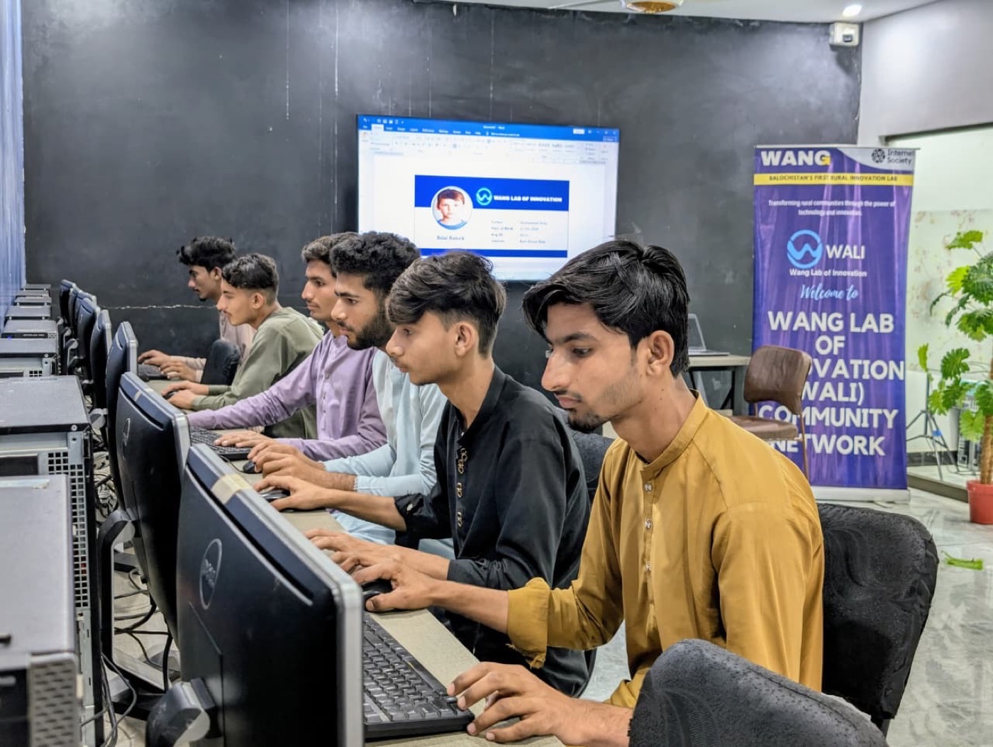 Learners using computers in a WALI lab where internet quality directly affects access