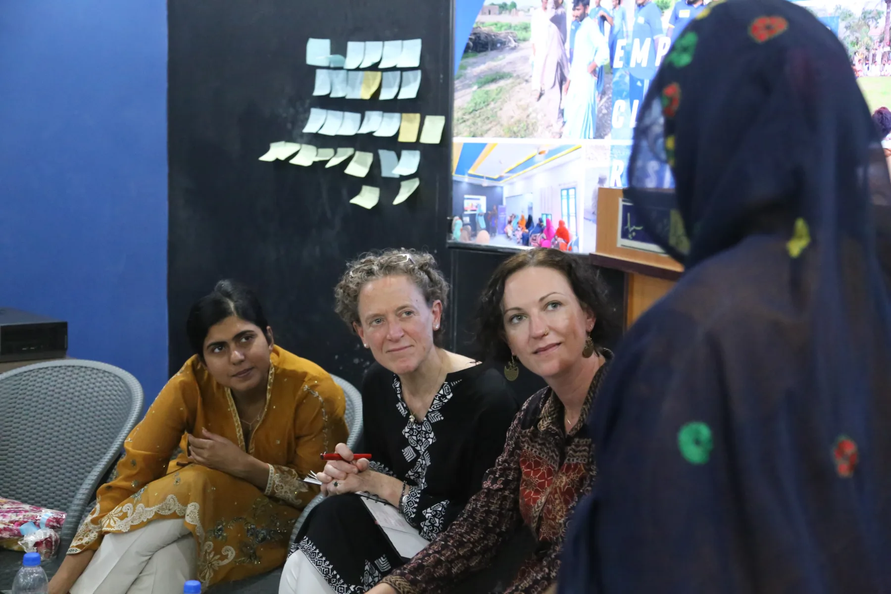 WALI community members and international partners listening together during a local session