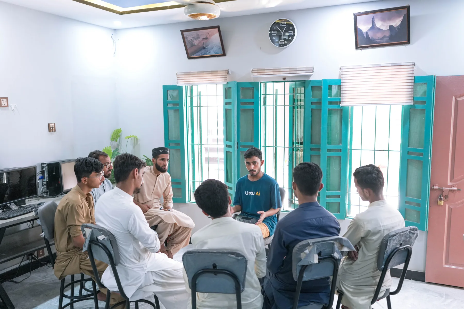 Young people taking part in a peer learning circle inside WALI