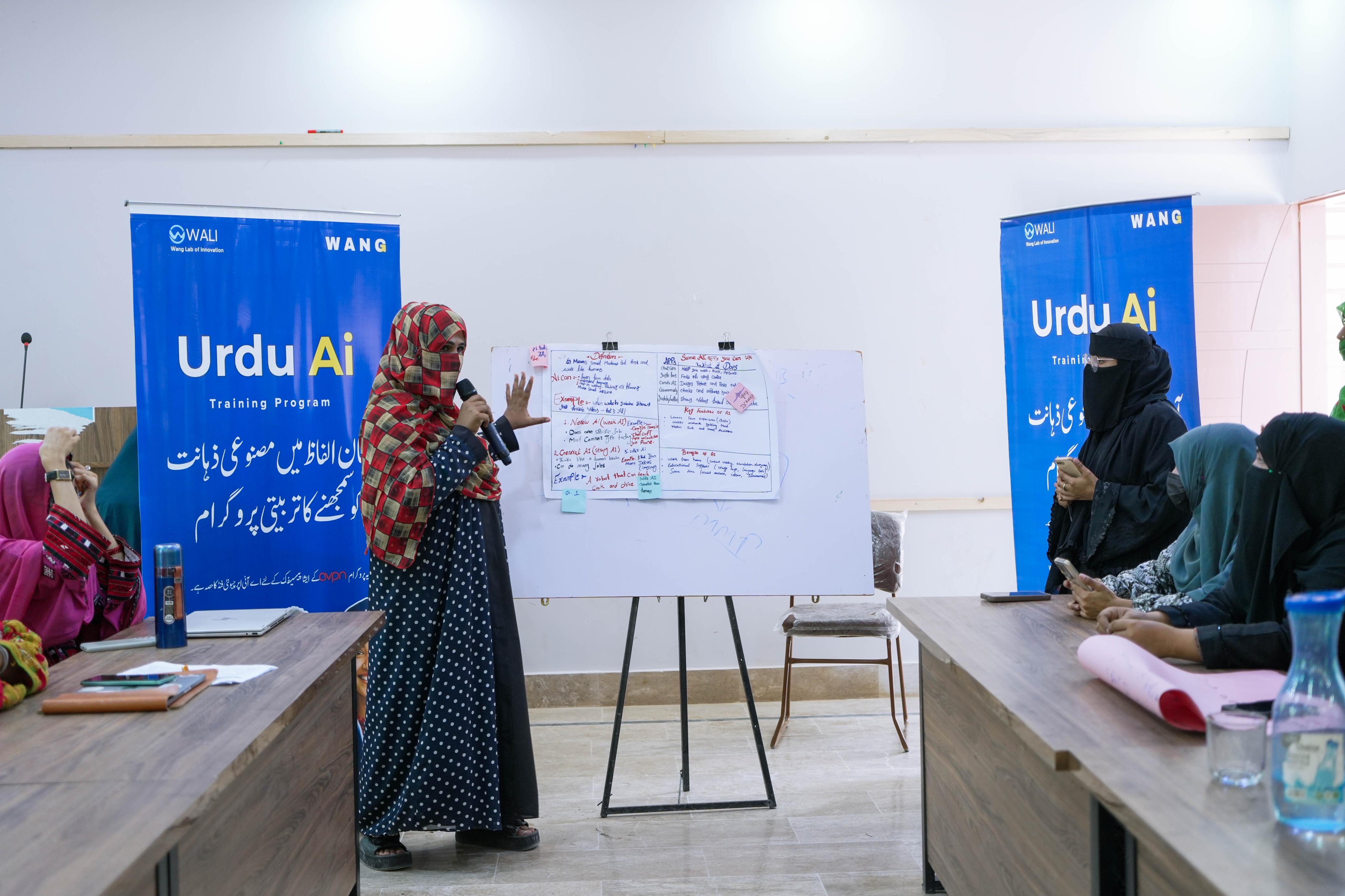 Women collaborating inside a WALI Urdu AI learning session