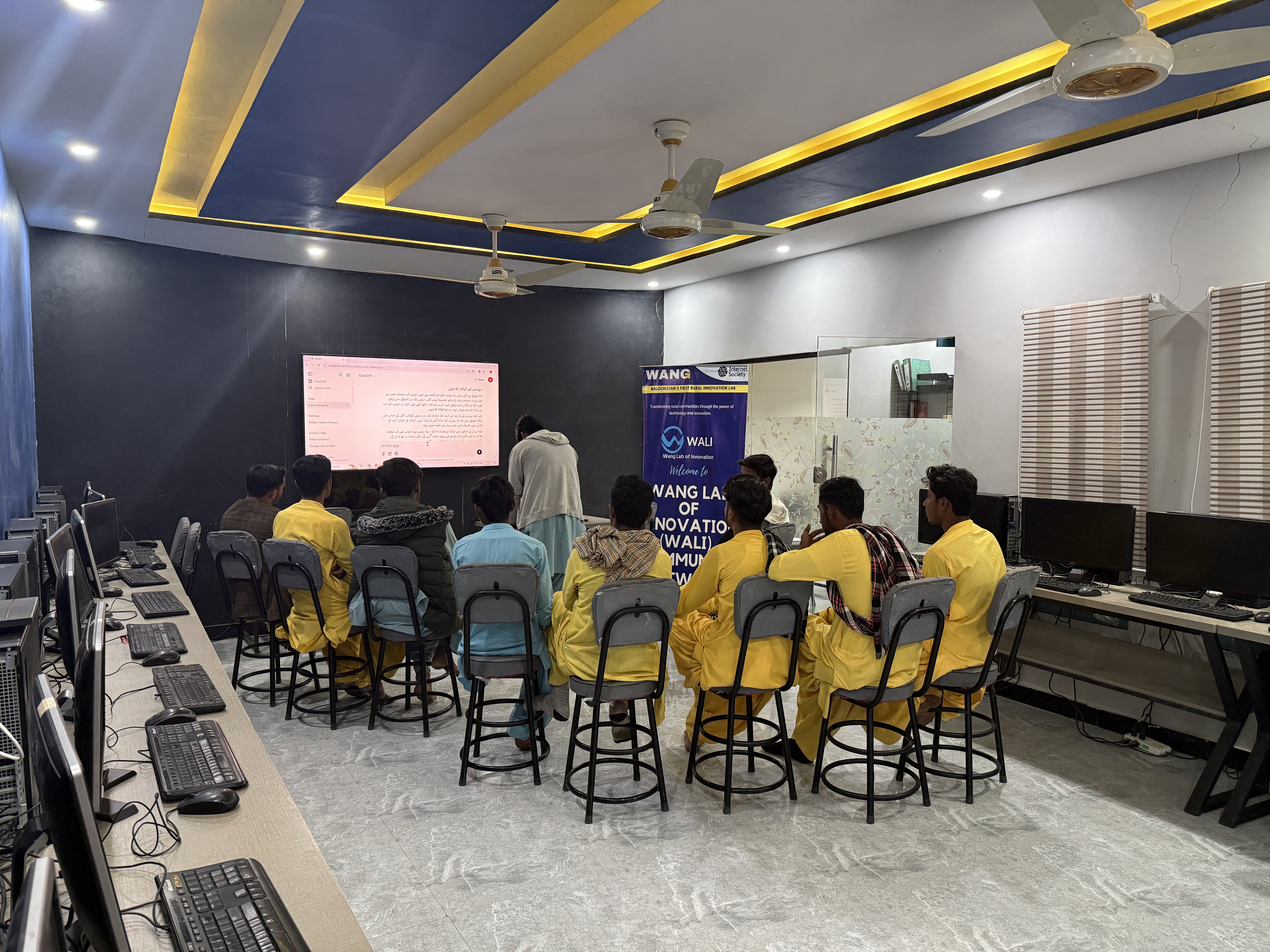 Women participating in a WALI Urdu AI workshop inside the lab